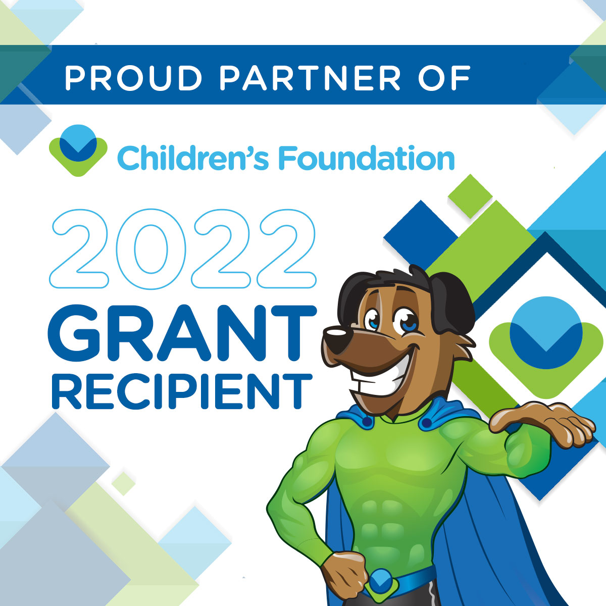 An illustrated dog wearing a superhero cape. Text reads "Proud Partner of Children's Foundation. 2022 grant recipient"
